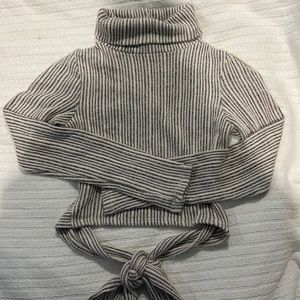 Bijou Apparel turtleneck long sleeve sweater and open back and tie. Size S